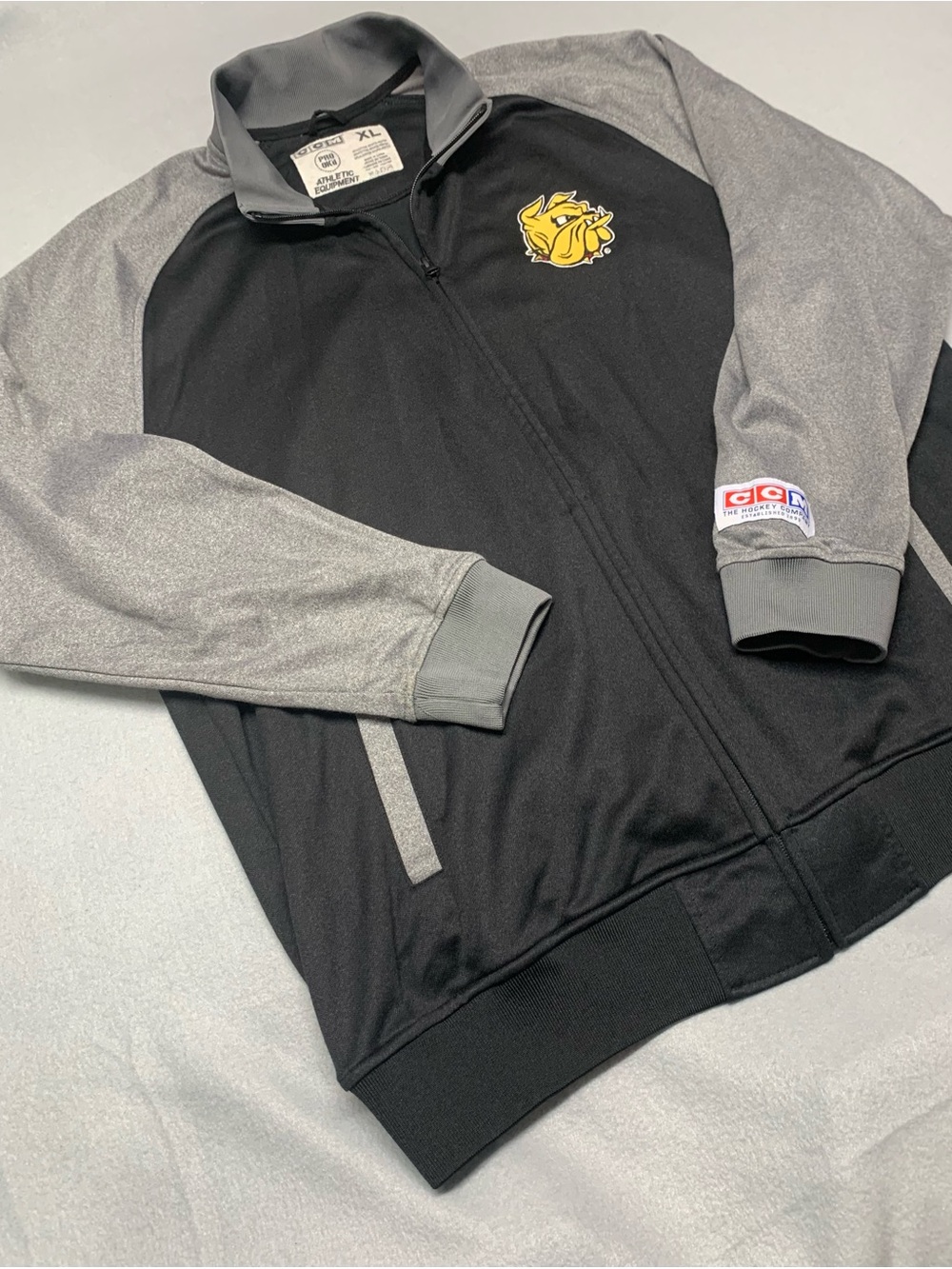 CCM UMD Black and Gray Full-Zip Performance Jacket with Yellow Bulldog Patch